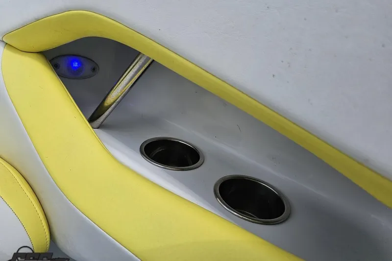 Slide: The Image of Interior of 2005 Baja 245 boat with cup holders and blue LED light. - 55