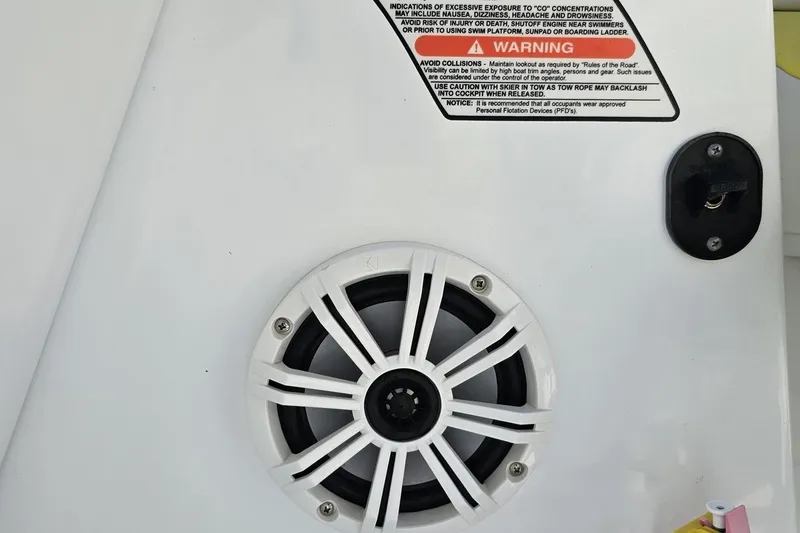 Slide: The Image of Speaker and warning label on 2005 Baja 245 boat interior. - 68