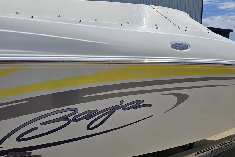 Slide: The Image of 2005 Baja 245 boat with sleek design and vibrant graphics. - 7