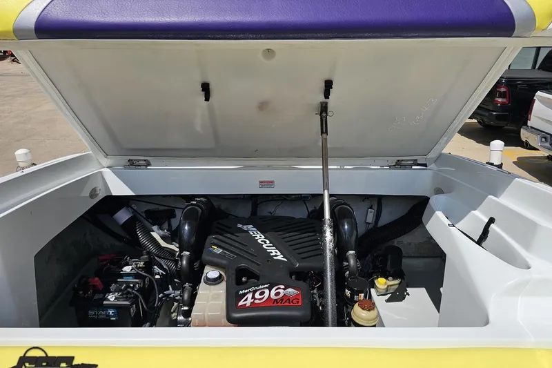 Slide: The Image of Open engine compartment of 2005 Baja 245 boat with MerCruiser 496 MAG engine. - 82