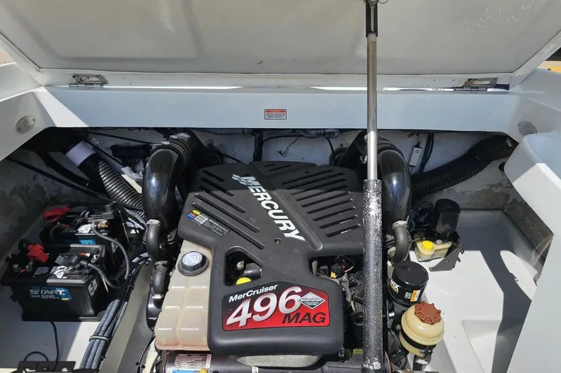 Slide: The Image of Engine compartment of a 2005 Baja 245 boat with MerCruiser 496 MAG engine. - 83