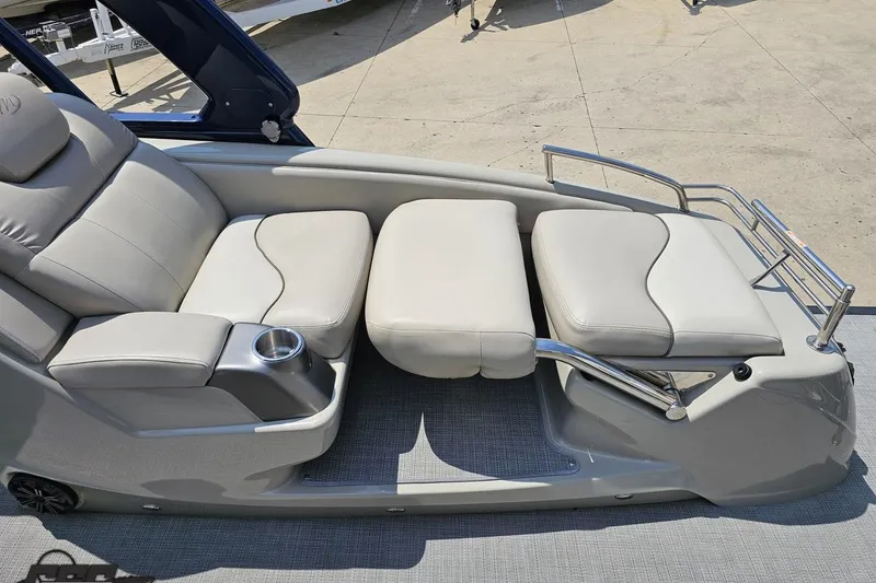 Slide: The Image of Luxurious seating on 2016 Manitou 23 Legacy boat with cup holder and sleek design. - 104