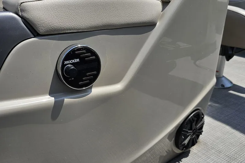 Slide: The Image of 2016 Manitou 23 Legacy boat interior with Kicker audio system detail. - 110