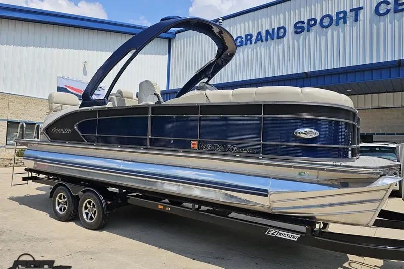 Slide: The Image of 2016 Manitou 23 Legacy pontoon boat on trailer at Grand Sport Center. - 14