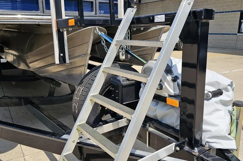 Slide: The Image of 2016 Manitou 23 Legacy boat trailer with ladder and winch system. - 18