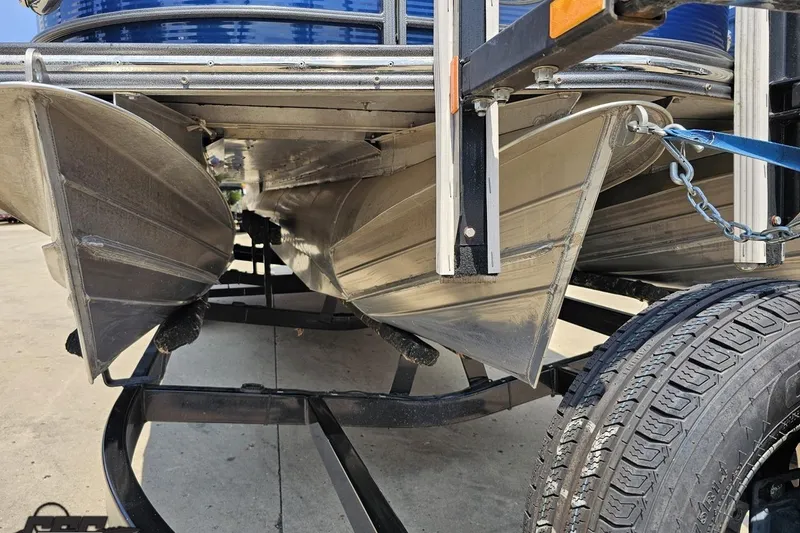 Slide: The Image of Underneath view of a 2016 Manitou 23 Legacy pontoon boat on a trailer. - 20