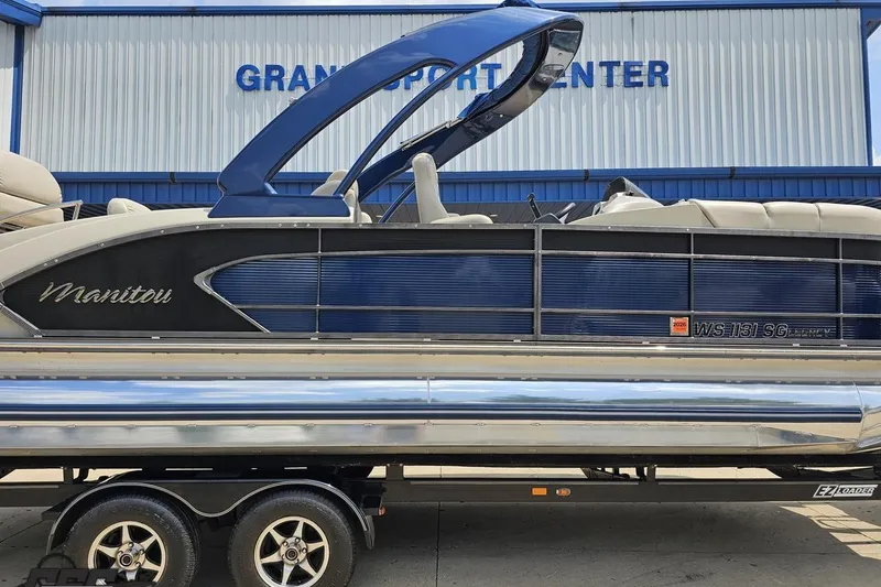 Slide: The Image of 2016 Manitou 23 Legacy pontoon boat on trailer at Grand Sport Center. - 3