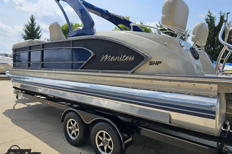 Slide: The Image of 2016 Manitou 23 Legacy pontoon boat on trailer, side view. - 42