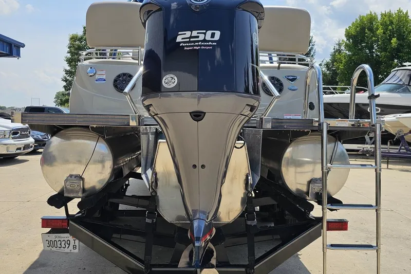 Slide: The Image of 2016 Manitou 23 Legacy pontoon boat with 250 horsepower engine, docked outdoors. - 46