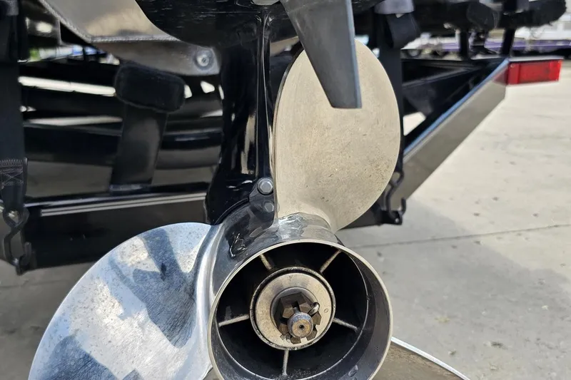 Slide: The Image of Close-up of a 2016 Manitou 23 Legacy boat propeller on a trailer. - 50