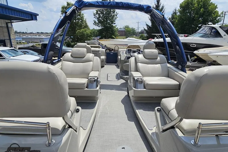 Slide: The Image of 2016 Manitou 23 Legacy pontoon boat with luxurious seating and sleek design. - 57