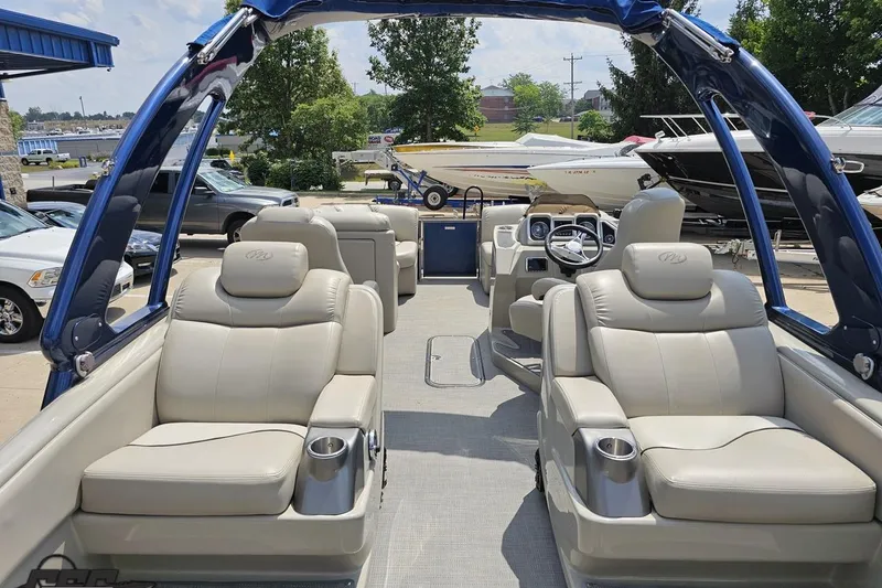 Slide: The Image of 2016 Manitou 23 Legacy pontoon boat with luxurious seating and modern design. - 58
