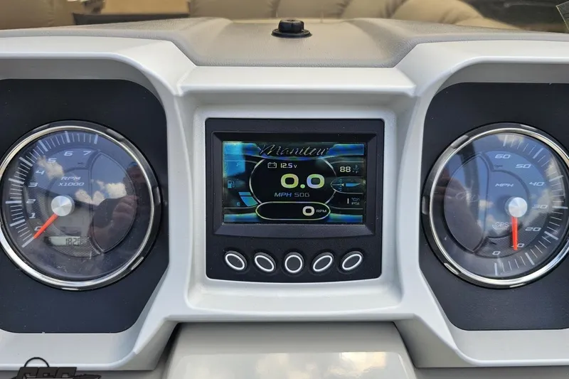 Slide: The Image of Dashboard of 2016 Manitou 23 Legacy boat with digital display and gauges. - 68