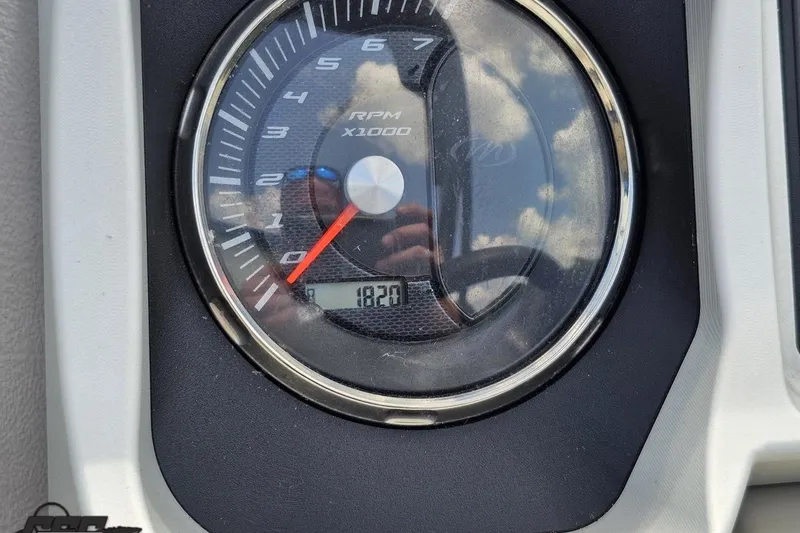 Slide: The Image of Tachometer of 2016 Manitou 23 Legacy showing 182 hours, reflecting sky and photographer. - 69