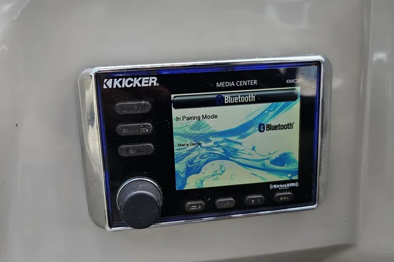 Slide: The Image of Kicker media center in 2016 Manitou 23 Legacy, displaying Bluetooth pairing mode. - 70