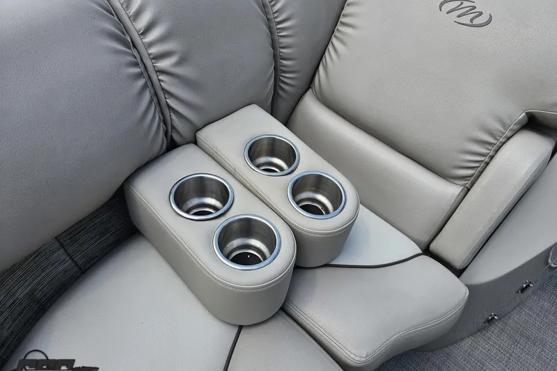 Slide: The Image of Luxurious seating with cup holders on 2016 Manitou 23 Legacy boat. - 87