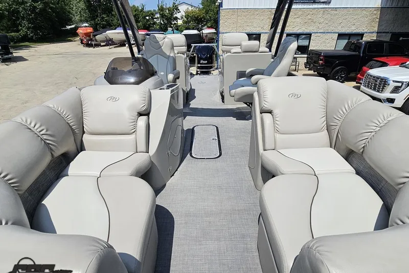 Slide: The Image of 2016 Manitou 23 Legacy pontoon boat with luxurious seating and modern design. - 89