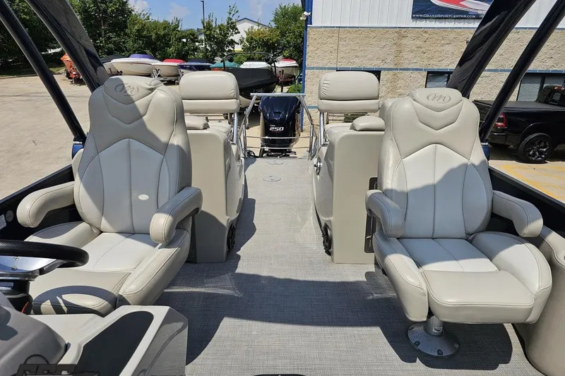 Slide: The Image of Interior of 2016 Manitou 23 Legacy boat with luxurious seating and modern design. - 90