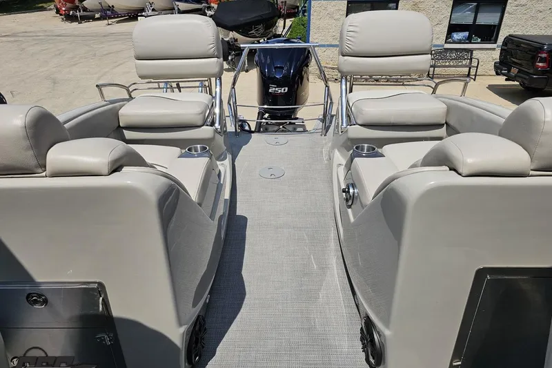 Slide: The Image of 2016 Manitou 23 Legacy boat interior with seating and 250 HP engine. - 96