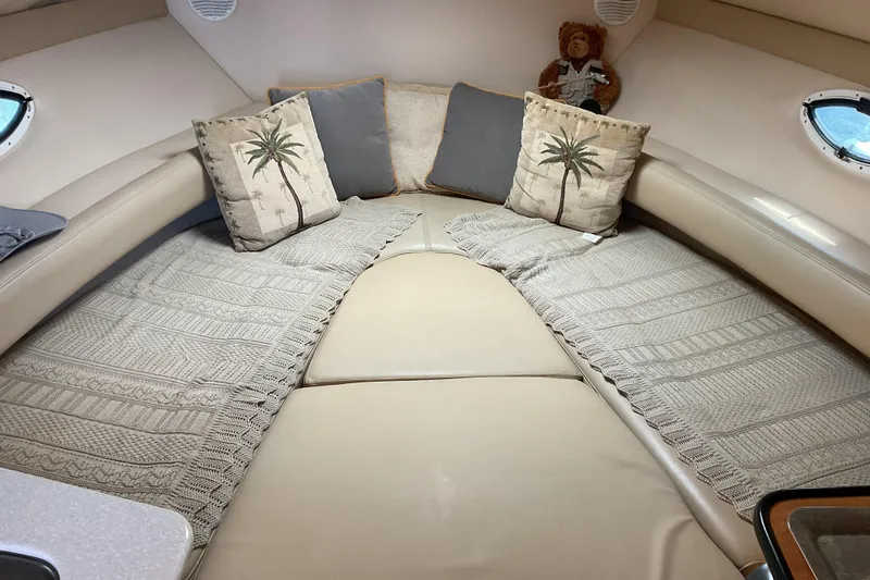 Slide: The Image of Cozy cabin interior of 2003 Maxum 2700 SCR with decorative pillows and plush bedding. - 18