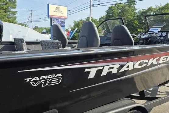 Slide: The Image of 2026 Tracker Targa V18 Combo boat, black exterior, parked outdoors. - 7
