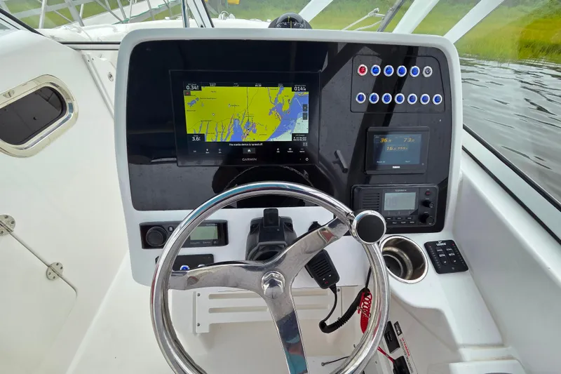 Slide: The Image of Edgewater 248 CX 2022 boat dashboard with navigation and control systems. - 4