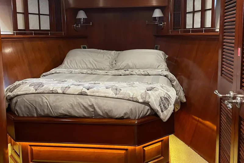 Slide: The Image of Luxurious kitchen on 2001 Rayburn Flush Deck yacht with stainless steel appliances and scenic view. - 14