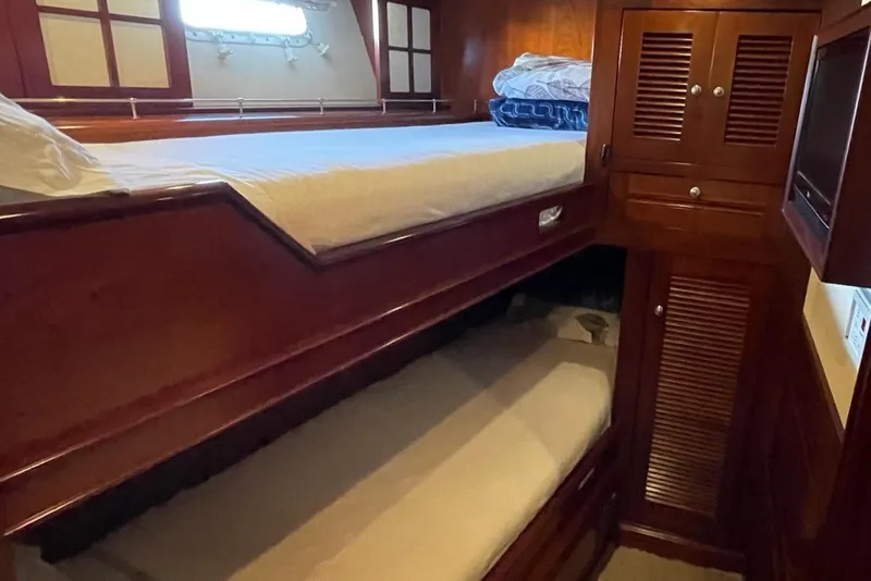 Slide: The Image of Luxurious 2001 Rayburn Flush Deck yacht helm with wooden finish and advanced navigation systems. - 17