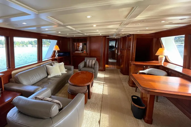 Slide: The Image of Luxurious 2001 Rayburn Flush Deck yacht interior with elegant wood finishes and scenic water views. - 2