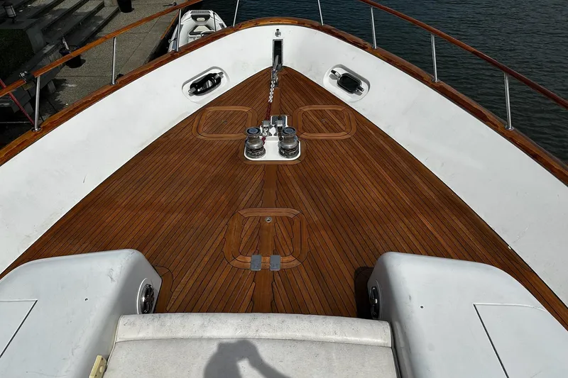 Slide: The Image of Luxurious interior of 2001 Rayburn Flush Deck yacht with elegant wood paneling and cozy seating. - 33