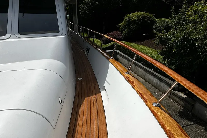 Slide: The Image of Luxurious 2001 Rayburn Flush Deck yacht interior with elegant wood finishes and marine artwork. - 34