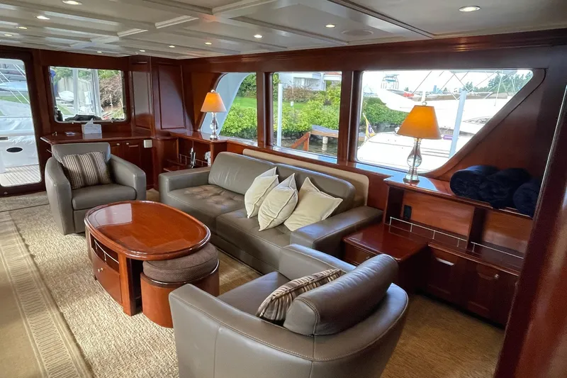 Slide: The Image of Luxurious 2001 Rayburn Flush Deck yacht interior with elegant seating and scenic ocean view. - 4