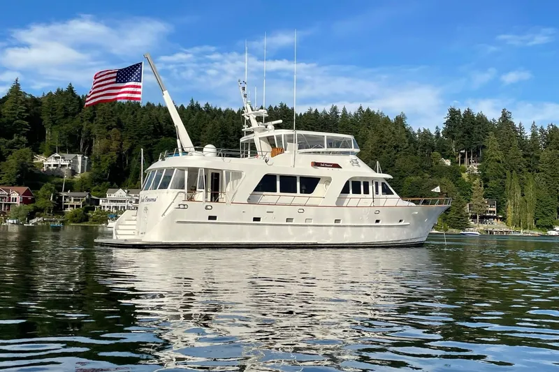 Slide: The Image of Luxurious 2001 Rayburn Flush Deck yacht interior with elegant seating and scenic waterfront view. - 45