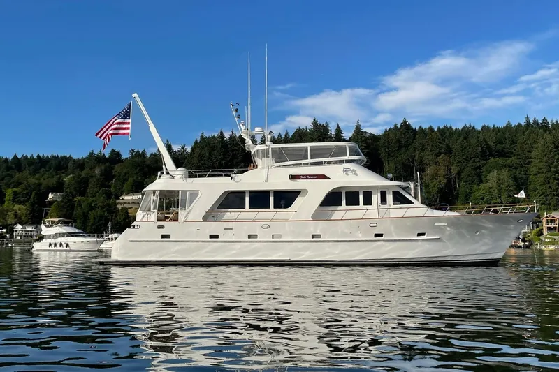 Slide: The Image of Luxurious 2001 Rayburn Flush Deck yacht interior with elegant seating and scenic waterfront view. - 46