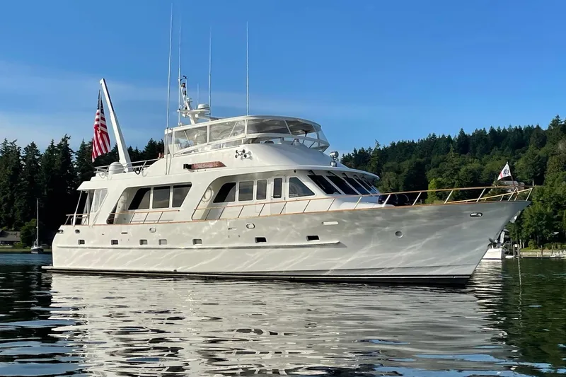 Slide: The Image of 2001 Rayburn Flush Deck yacht with Highfield tender, scenic waterfront view. - 48