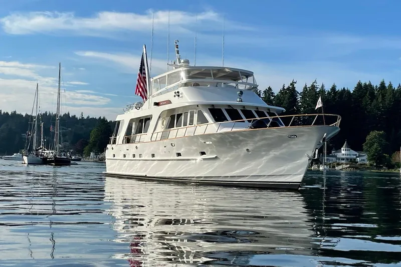 Slide: The Image of 2001 Rayburn Flush Deck yacht with open deck and seating, cruising on a sunny day. - 49