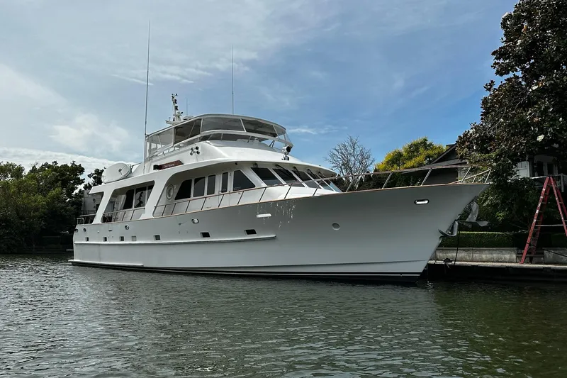 Slide: The Image of Luxurious 2001 Rayburn Flush Deck yacht interior with wooden flooring and elegant dining area. - 50