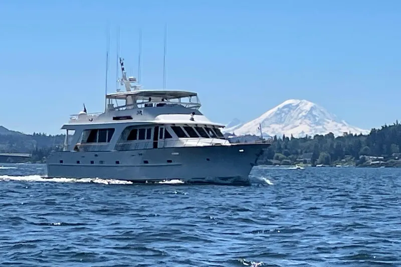 Slide: The Image of Luxurious 2001 Rayburn Flush Deck yacht with outdoor seating and scenic water view. - 51