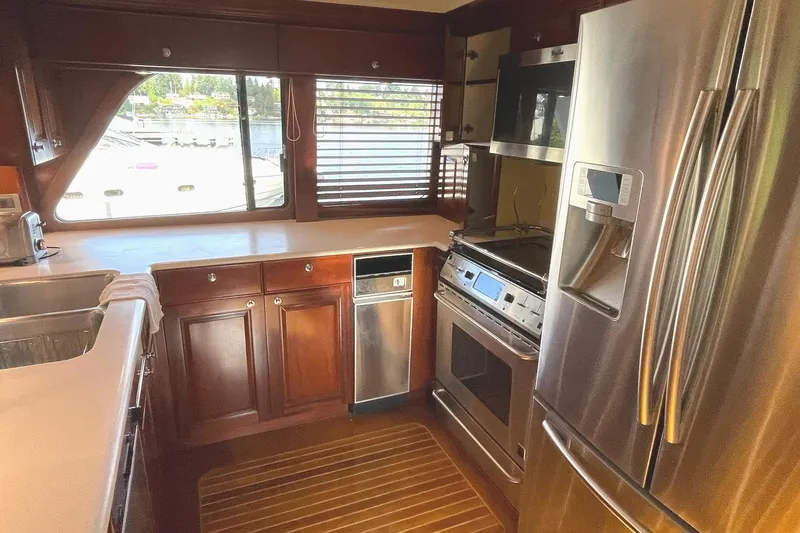 Slide: The Image of Luxurious interior of 2001 Rayburn Flush Deck yacht with polished wood finish. - 6