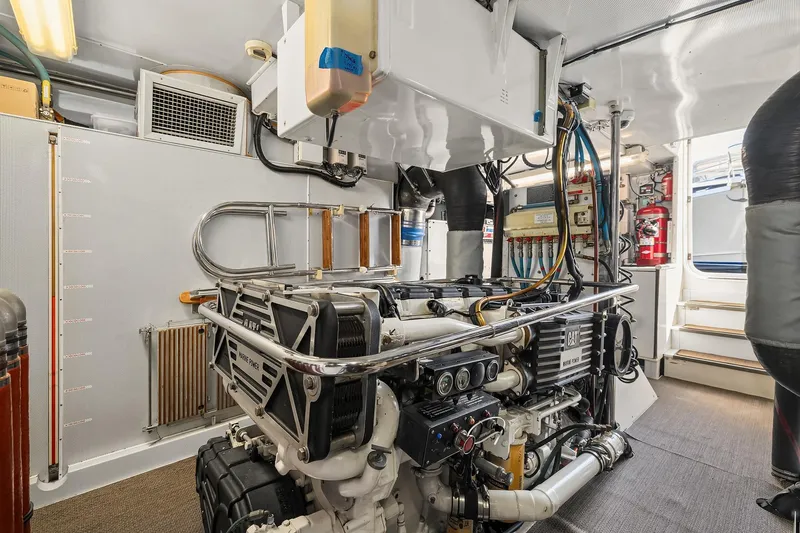 Slide: The Image of Control panel of a 2001 Rayburn Flush Deck yacht with joystick and buttons. - 68