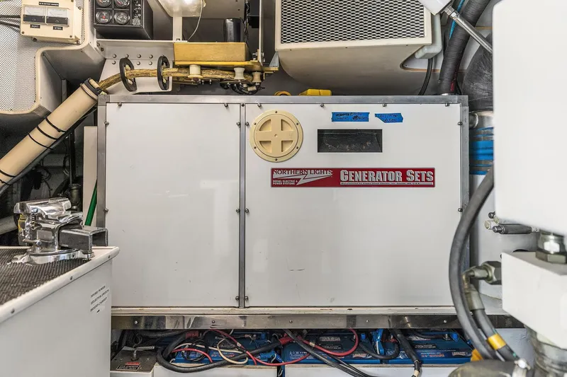 Slide: The Image of Engine room of 2001 Rayburn Flush Deck yacht with tools and equipment. - 70