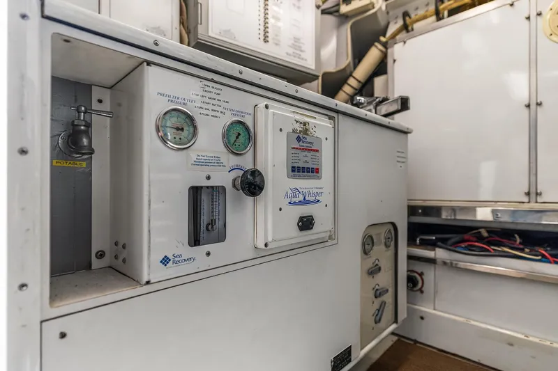 Slide: The Image of Engine room of a 2001 Rayburn Flush Deck yacht, featuring marine power systems. - 75