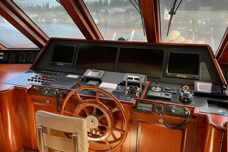 Slide: The Image of Luxurious interior of 2001 Rayburn Flush Deck yacht with elegant wood finish and scenic water view. - 8