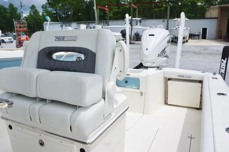 Slide: The Image of 2024 Pathfinder 2700 Open boat interior with seating and Yamaha engine. - 15
