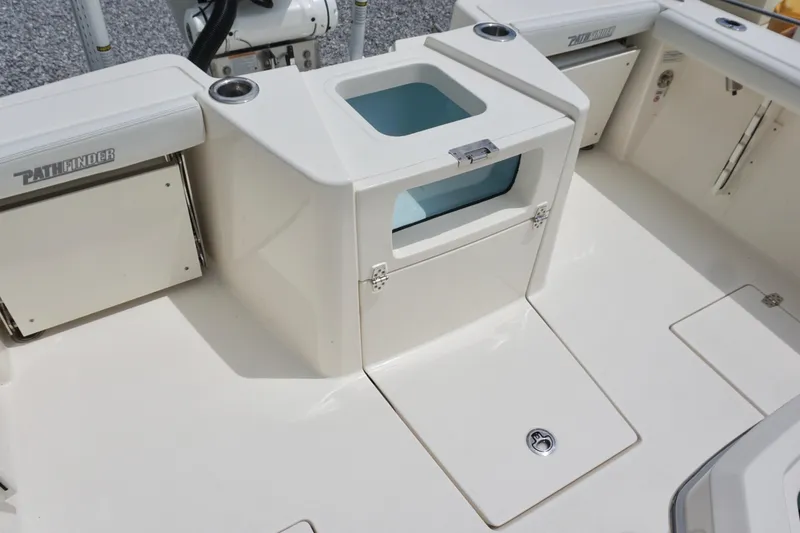Slide: The Image of 2024 Pathfinder 2700 Open boat interior with storage compartments and seating. - 16