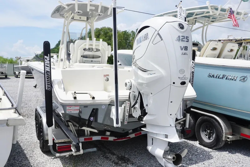 Slide: The Image of 2024 Pathfinder 2700 Open boat with Yamaha 425 engine, parked on gravel. - 5