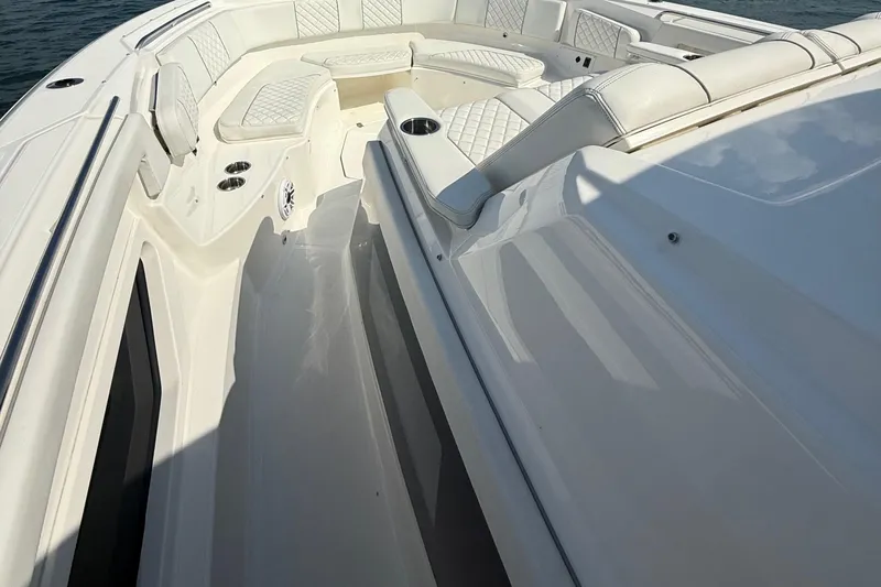 Slide: The Image of 2022 Pursuit S 378 Sport boat interior with white seating and sleek design. - 13