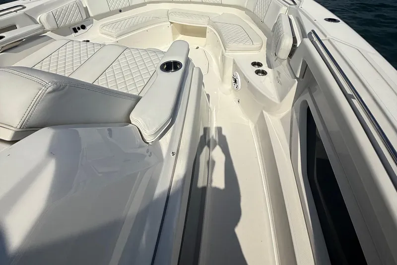 Slide: The Image of Luxurious seating on 2022 Pursuit S 378 Sport boat with white quilted upholstery. - 19