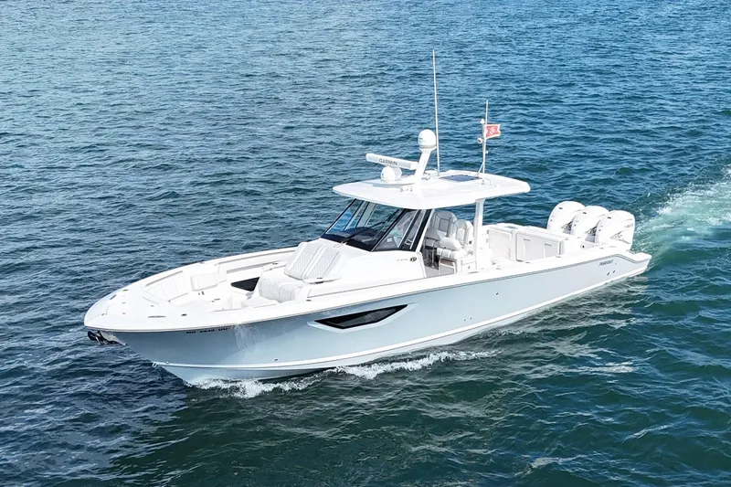 Slide: The Image of 2022 Pursuit S 378 Sport boat cruising on open water. - 2