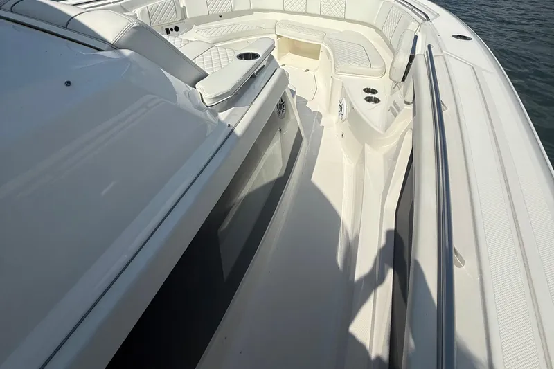 Slide: The Image of 2022 Pursuit S 378 Sport boat deck with seating and cup holders. - 21